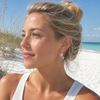 Sterling silver sapphire blue crystal mermaid earrings worn by sandy blonde model on Florida Gulf Coast beach — handcrafted in Ireland — Crabby Mermaid