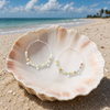 Amazonite stone disc hoop earrings in silver displayed in a white seashell on a Florida Gulf Coast beach - Crabby Mermaid