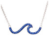 A sterling silver wave necklace accented with sapphire blue crystals, symbolizing ocean energy and summer sea vibes.