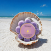 Spongellé French Lavender Wild Flower body wash buffer nestled in seashell on white sand Florida beach - Crabby Mermaid