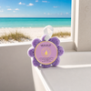 Spongellé French Lavender Wild Flower body wash buffer on white bathtub edge with Florida beach view through window — Crabby Mermaid