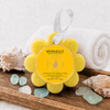 Spongellé Sweet Patchouli Wild Flower body wash buffer on wooden bath tray with white towel, sea glass, and shells — Crabby Mermaid