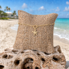 18K gold paperclip charm keeper bracelet with gold starfish charm on burlap jewelry display with Florida Gulf Coast beach background - Crabby Mermaid