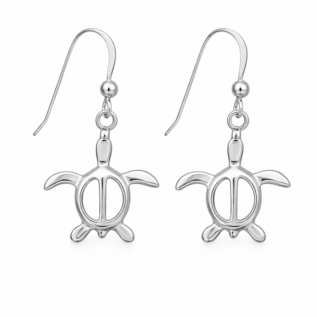 Sterling silver Honu sea turtle dangle earring worn on model at beach - French wire hook coastal jewelry