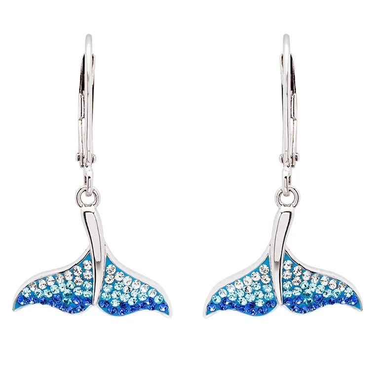Sterling silver whale tail drop earrings with ombre blue crystals and lever-back closures on white background - handcrafted in Ireland - Crabby Mermaid