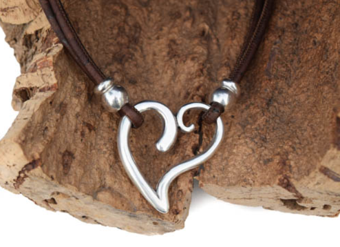 Sterling silver open-work heart pendant on brown Portuguese cork cord with silver bead accents displayed on driftwood — Crabby Mermaid