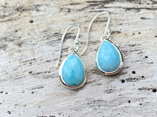 Close-up of Larimar teardrop earrings in .925 sterling silver bezel setting — French wire hooks — Crabby Mermaid