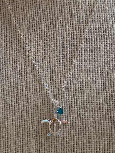 Honu Sea Turtle Necklace in Sterling Silver


Ocean Lovers Delight! This beautiful Sterling Silver sea turtle necklace is inspired by the Hawaiian Honu - sea turtle and paired with indicolite Swarovski crystal for an added appeal. Featuring a Sterling Silver 18" chain with a spring clasp.

Handmade in the USA