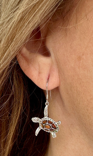 Close-up of sterling silver and Hawaiian Koa wood sea turtle dangle earrings — French wire hooks — Crabby Mermaid