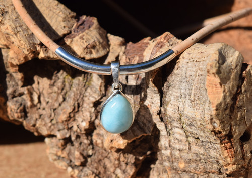 Close-up of genuine Larimar teardrop in sterling silver bezel on cork cord with tube accent — Florida artisan jewelry — Crabby Mermaid