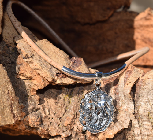 Sterling silver mermaid cork necklace displayed on cork slab showing magnetic clasp and tube accent — Florida artisan jewelry