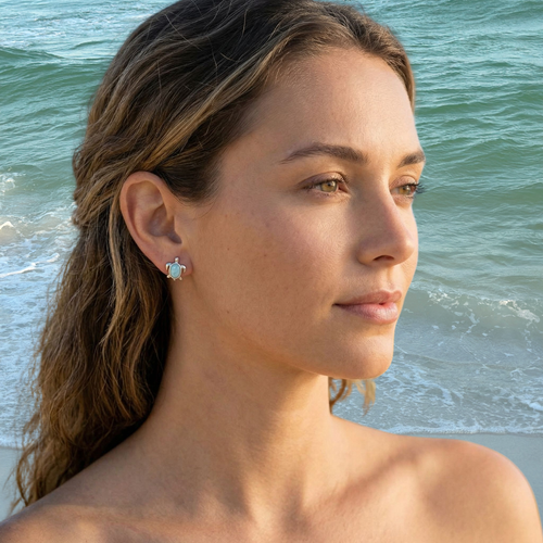 Larimar turtle stud earring worn on model at beach — genuine Dominican Republic Larimar in .925 sterling silver — Crabby Mermaid