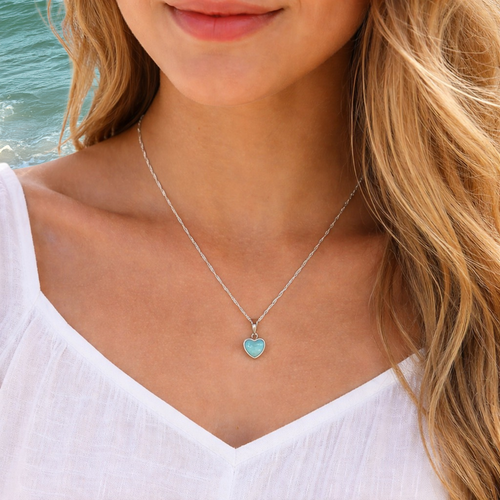 Larimar heart necklace worn on model at beach — hand assembled by Crabby Mermaid — genuine Dominican Republic Larimar
