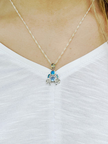 Tanzanite and blue opal crab necklace in sterling silver worn on model ‚Äî Crabby Mermaid