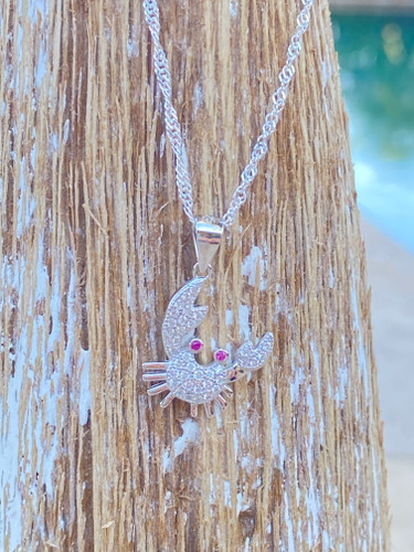 Close-up of .925 sterling silver crab pendant with CZ stone accents ‚Äî coastal jewelry ‚Äî Crabby Mermaid