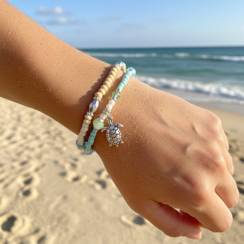 Natural wood and crystal double strand turtle stretch bracelet worn on wrist at beach — coastal jewelry — Crabby Mermaid
