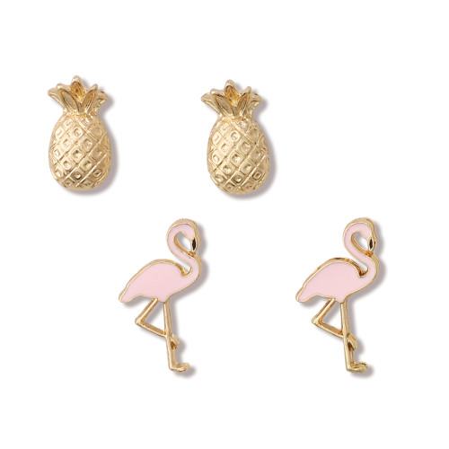 Gold-toned pineapple stud earrings and pink enamel flamingo stud earrings on white background — tropical jewelry set — Crabby Mermaid