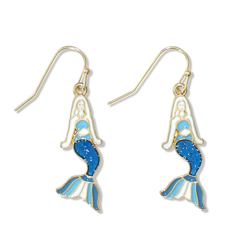 Gold-toned mermaid dangle earrings with white enamel body and blue glitter scales on white background ‚Äî coastal jewelry ‚Äî Crabby Mermaid