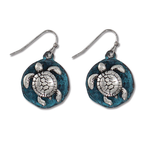 Round teal patina disc dangle earrings with raised silver-toned sea turtle detail on white background — coastal jewelry — Crabby Mermaid