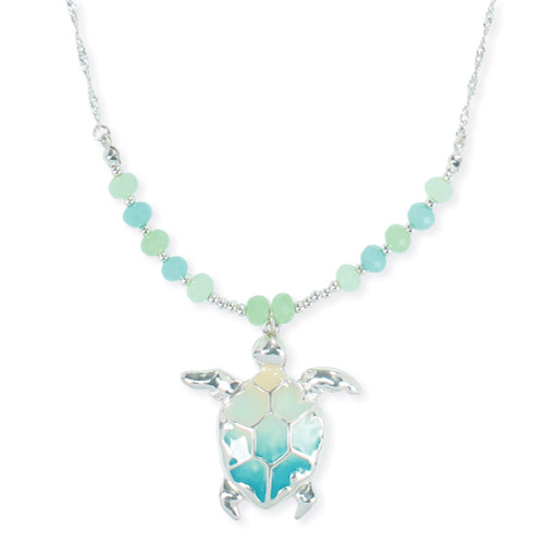Silver-toned ombre sea turtle pendant necklace with aqua and mint faceted bead strand on white background — coastal jewelry — Crabby Mermaid