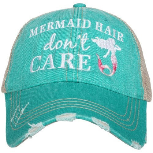 Teal trucker hat with Mermaid Hair Don’t Care embroidery, mesh back, adjustable closure, and ponytail-friendly design
