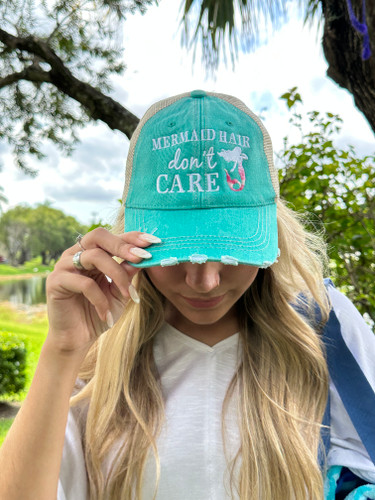 Mermaid Hair Don’t Care Trucker Hat

A day out on the water will do a number on anyone’s hair, but you won’t even mind when you’re wearing one of these cool “Mermaid Hair Don’t Care” Trucker Hats.

These hats feature a beautiful custom mermaid and text embroidery with the Mermaid Hair Don’t Care on intentionally distressed fabric for a cool vintage vibe look. With its vibrant teal color, this hat is a perfect look for all outdoor lovers. Perfect for those bad hair days when you are in a hurry. Face it, you know we all have them, so why not embrace them with style. They’re even perfect for ponytails.  

This hat is super comfortable and stylish for mermaid lovers of all ages. Just throw on this super-cute trucker hat and get out and enjoy the outdoors, while protecting your hair and face from the sun.



Hat details:

These trucker caps are embroidered with high-quality stitching and have a curved bill for added protection from the sun
The washed distressed style cap and contrast stitching gives it a worn vintage look
With an adjustable tab and a mesh back to easily fit your head and allow air to flow so they’re not as hot as a traditional hat and helps to keep you cooler on those hot summer days
The hat is made of 80% cotton and 20% polyester
This hat is one size fits most, making is perfect for kids, teens, and adults
The hat is a vibrant teal color with the words “Mermaid Hair Don’t Care” in white embroidered lettering and a beautiful embroidered white and pink mermaid


You can also check out our Mermaid Hair Don’t Care trucker hat in gray.  Grab one to match each outfit or give to a friend. You’re going to love it!