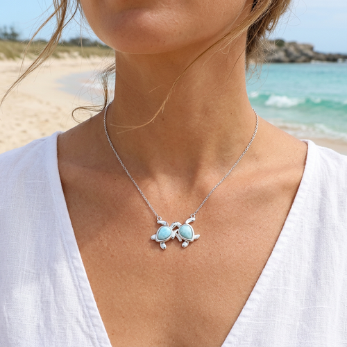 Larimar two turtle sterling silver necklace worn on model at the beach ‚Äî genuine Dominican Republic Larimar ‚Äî Crabby Mermaid
