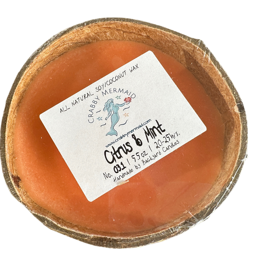 Citrus and mint half shell coconut candle top view with Crabby Mermaid label - 5.5 oz soy coconut wax candle on white background