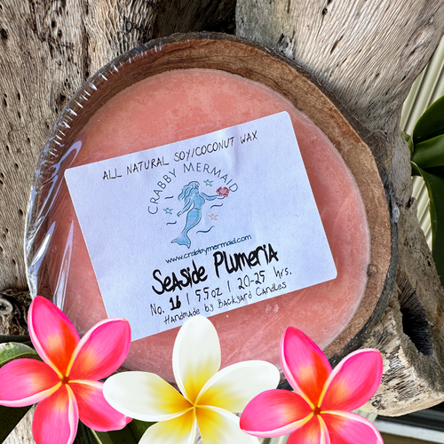 Seaside Plumeria Half Shell Coconut Candle - 5.5 oz

This Spring fragrance, which carries a pleasant combination of sweet and tart, will surely bring out your senses. Atop juicy notes lies an array of floral undertones that mingle and create a pleasant blend. Delight your senses with a gentle tropical bouquet just by lighting this Plumeria Half Shell Coconut Candle!

These candles also make an ideal gift. Be sure to check out our entire collection of fragrances.

Note Profile:

Top: Green Leaves, Guava

Middle: Plumeria, Jasmine, Gardenia

Base: Powder

5.5 oz - lasts 20-25 hours and is great for small/medium size rooms

Ingredients: All natural soy and coconut waxes, phthalate-free premium fragrance oils and essential oils, concentrated dyes, and a cotton wick.

Our coconut candles are hand-poured into real, up-cycled coconuts in San Diego, CA., Made exclusively for Crabby Mermaid.

Never leave a candle burning unattended. Do not burn for more than 4 hours at a time. Keep wick trimmed to 1/4 in. before each lighting. Burn only on a stable, heat-resistant surface/plate. Do not burn directly on countertops or near anything that could catch fire. Discontinue use if the coconut shell cracks. Keep out of reach of children and pets.