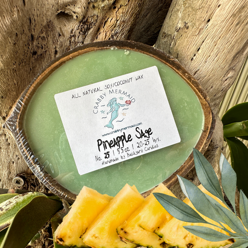 Pineapple Sage Half Shell Coconut Candle - 5.5 oz

An upscale fragrance that brings together sweet pineapple and aromatic sage in a very unexpected way. This fragrance is infused with guaiac wood, cedarwood, and eucalyptus essential oils to add a unique twist to this wonderful garden herb.

These candles also make an ideal gift. Be sure to check out our entire collection of fragrances.

Note Profile:

Top: Pineapple

Middle: Green Leaves, Palm, Anise

Base: Sage, Sugar

5.5 oz - lasts 20-25 hours and is great for small/medium size rooms

Ingredients: All natural soy and coconut waxes, phthalate-free premium fragrance oils and essential oils, concentrated dyes, and a cotton wick.

Our coconut candles are hand-poured into real, up-cycled coconuts in San Diego, CA., Made exclusively for Crabby Mermaid.

Never leave a Candle burning unattended. Do not burn for more than 4 hours at a time. Keep wick trimmed to 1/4 in. before each lighting. Burn only on a stable, heat-resistant surface/plate. Do not burn directly on countertops or near anything that could catch fire. Discontinue use if the coconut shell cracks. Keep out of reach of children and pets.