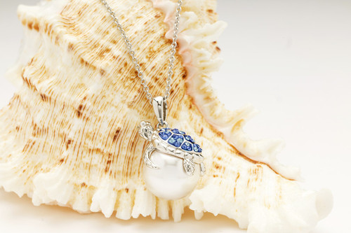 Silver sea turtle pendant with sapphire crystal shell wrapped around freshwater pearl ‚Äî Dublin Assay Office Irish coastal jewelry