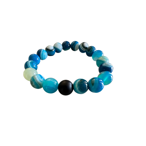 Blue agate 8mm gemstone beaded stretch bracelet on white background — vivid ocean blue and charcoal beads — Crabby Mermaid