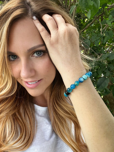 Blue Agate Gemstone Beaded Stretch Healing Bracelet - 8mm

Discover a spiritual connection and re-energize with our Gem Stone Beaded Stretch Spiritual Healing Bracelet! Featuring natural, semi-precious stones, this handcrafted bracelet is perfect for healing, growth, and meditation. It is made of 10mm blue agate stones that provide calming, cooling, and uplifting properties, making this the perfect companion for healing the body and soul. The stretch band offers a comfortable and flexible fit for most wrist sizes. This gemstone beaded bracelet showcases its unique beauty and adds effortless, spiritual elegance to any look. Treat yourself to our spiritual healing bracelet for ultimate spiritual connection.

Blue agate has come to symbolize tranquility, peace, and restorative power. It is recognized for balancing out harmful energies and encouraging positive vibes.

The calming properties of blue agate are beneficial in reducing stress, uneasiness, and sadness. In addition, this precious stone promotes the healing of one's soul, body, and mind by stabilizing their energies.