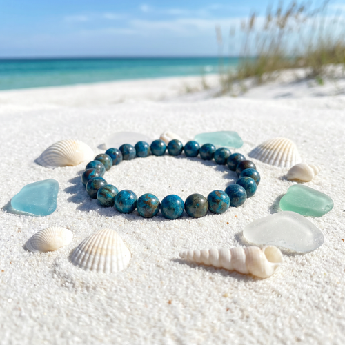 Natural Oak Jasper gemstone beaded stretch bracelet on white sand with seashells and sea glass — Florida Gulf Coast beach — Crabby Mermaid