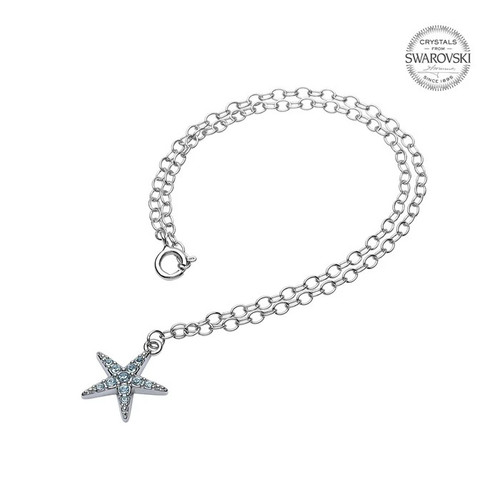 Sterling silver starfish anklet with aqua Swarovski crystals worn on model at beach — handcrafted in Ireland — Crabby Mermaid
