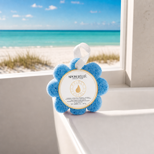 Spongellé Freesia Pear Wild Flower body wash buffer on white bathtub edge with Florida beach view through window - Crabby Mermaid