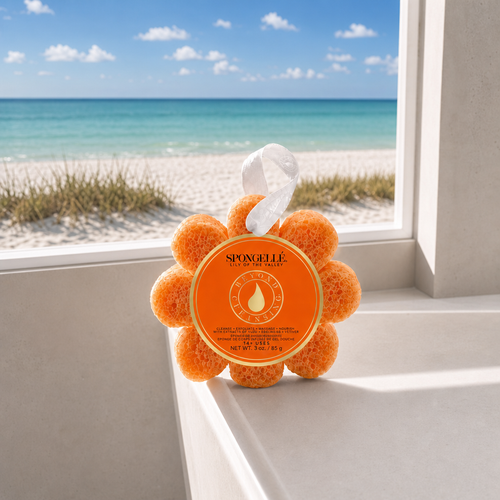 Spongellé Lily of the Valley Wild Flower body wash buffer on white bathtub edge with Florida beach view through window - Crabby Mermaid