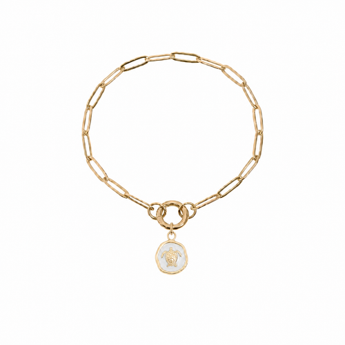 Gold paperclip charm keeper bracelet with white epoxy sea turtle medallion charm on white background - Crabby Mermaid