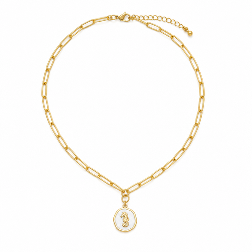 Gold paperclip chain necklace with white epoxy seahorse charm on white background - Crabby Mermaid