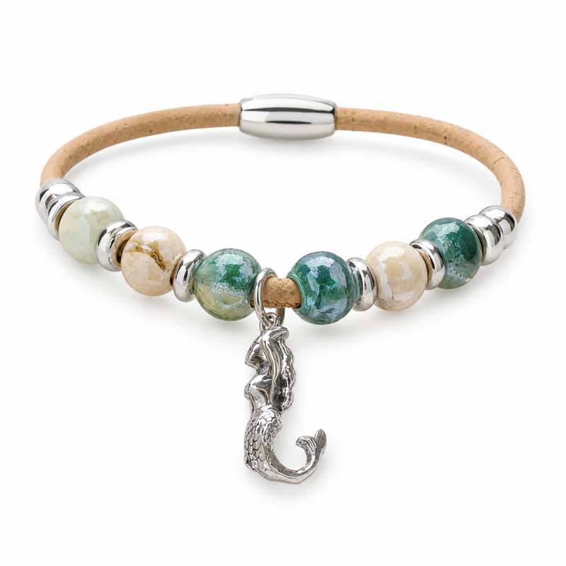 Cork bracelet with ceramic beads and sterling silver mermaid charm on white background — Crabby Mermaid