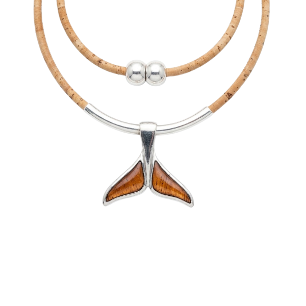 Koa wood whale tail pendant on cork cord with sterling silver tube accents on white background — Crabby Mermaid