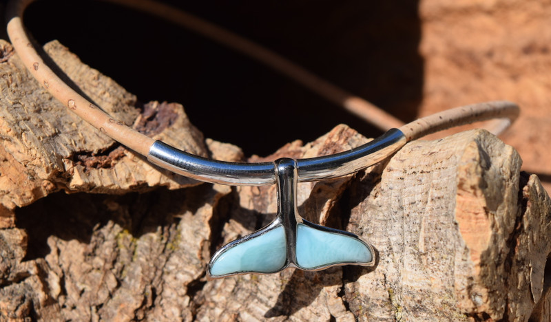 Close-up of genuine Larimar whale tail pendant on natural Portuguese cork cord with sterling silver tube accent — Crabby MermaidWhales