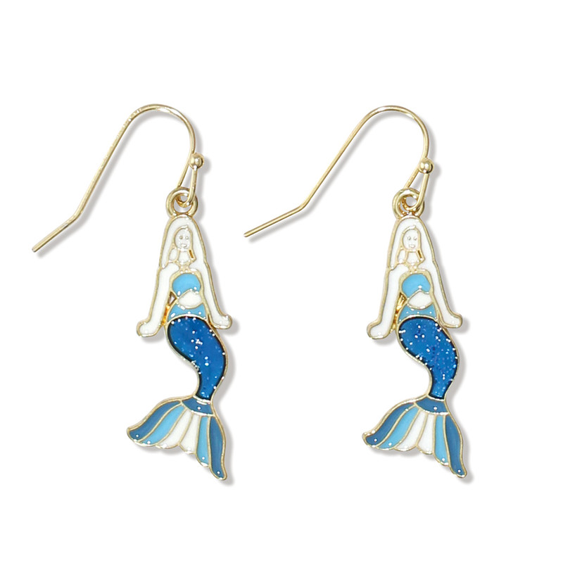 Gold-toned mermaid dangle earrings with white enamel body and blue glitter scales on white background — coastal jewelry — Crabby Mermaid