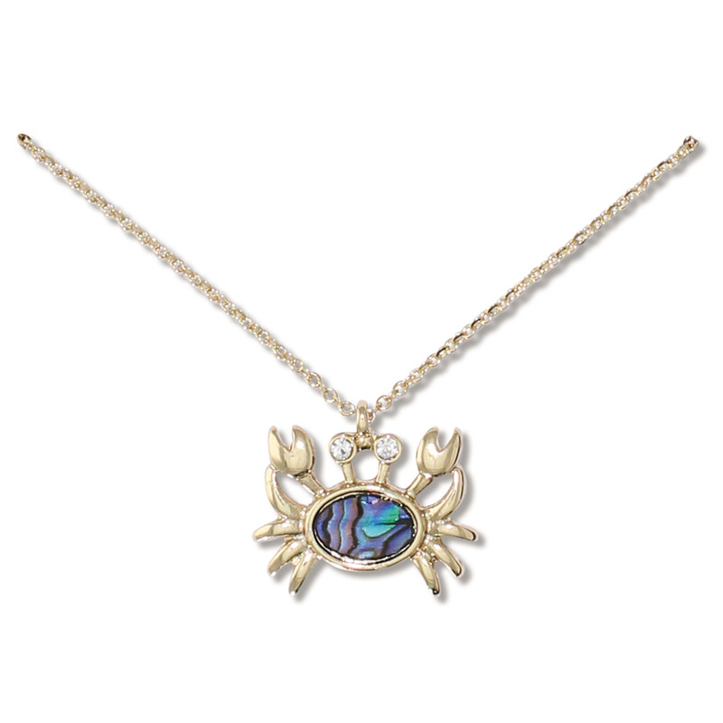 Gold-toned abalone inlay crab pendant necklace with crystal eyes on white background — coastal jewelry — Crabby Mermaid