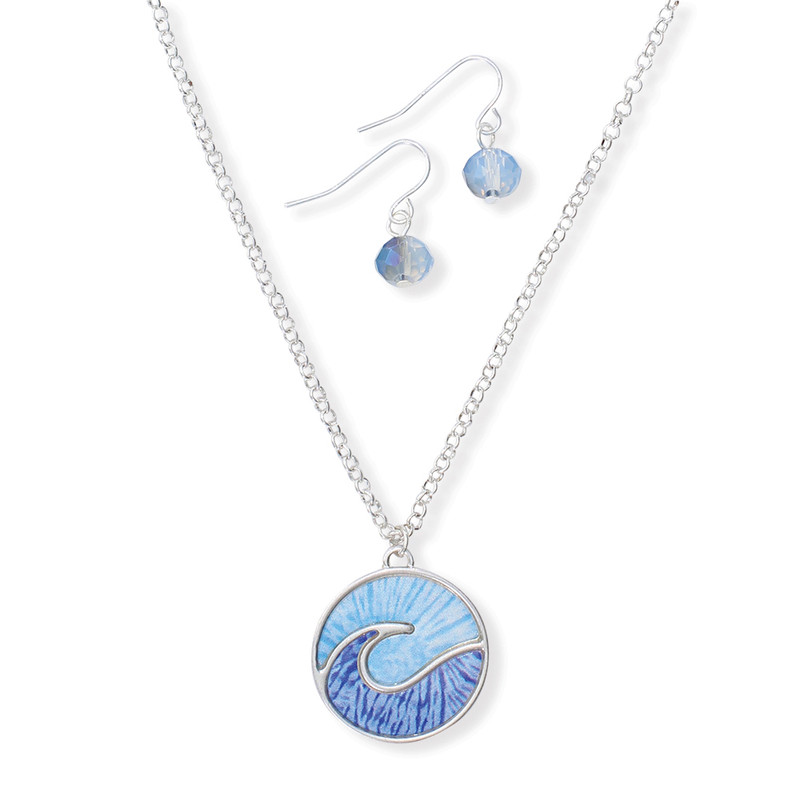Blue enamel wave disc pendant necklace and matching blue crystal dangle earring set on white background — coastal jewelry set — Crabby Mermaid