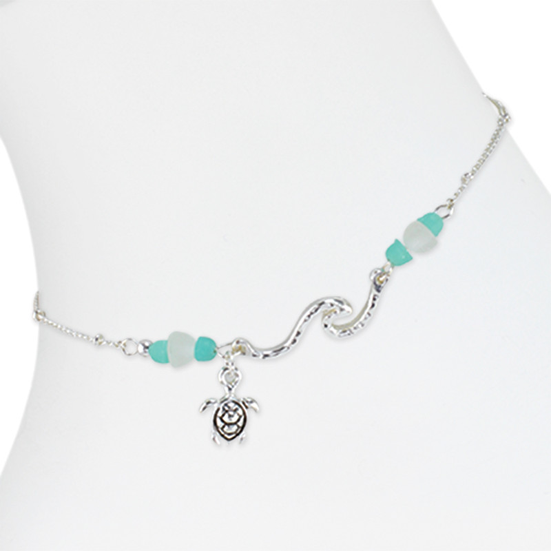 Hammered silver-tone wave and sea turtle charm anklet with turquoise and white sea glass style bead accents on white background — coastal beach anklet — Crabby Mermaid
Anklet comes with lobster claw clasp & 2" extender