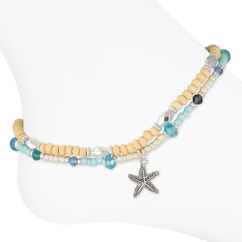 Double layer starfish beaded anklet with wooden beads and blue teal crystal beads on white background — coastal beach anklet — Crabby Mermaid