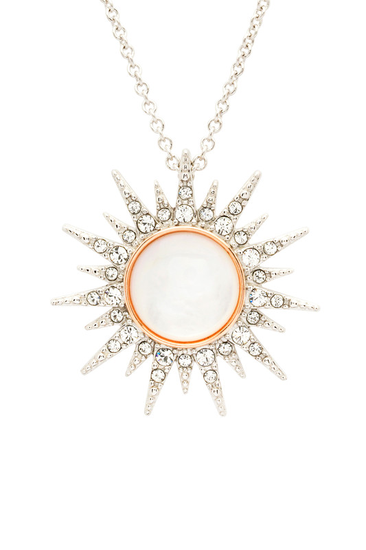 Sterling Silver Mother Of Pearl / Crystal Rose Gold Sun Necklace

Our Sun Necklace is a stunning and glamorous accessory that combines the symbology of the Sun and the Mother of Pearl in one piece. The Sun represents many of the best memories that occur in the light of the Sun. Similarly, it symbolizes vigor, optimism, clarity, and self-assurance. The Mother of Pearl, on the other hand, signifies transformation and growth. Hence, this stunning piece of jewelry is the perfect gift for someone who is the beacon of light in your life.

This stunning Sterling Silver Mother of Pearl and Crystal Rose Gold Sun Necklace houses 33 sparkling crystals. A plain bail links the pendant to an 18" Sterling Silver chain with a 2" adjustable extension. This feature lets you choose the length to suit your neckline.