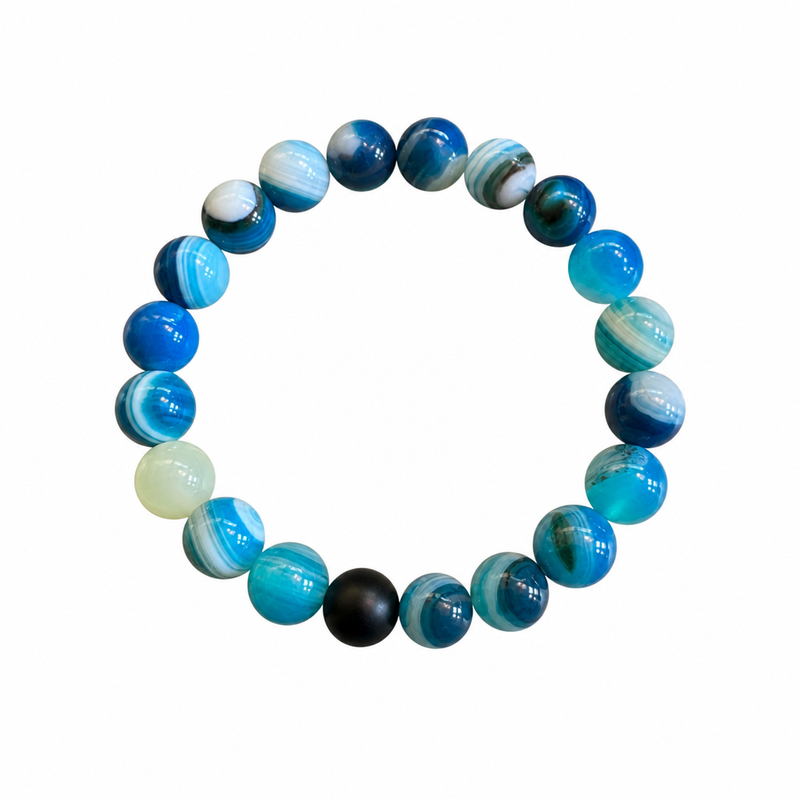 Blue agate 8mm gemstone beaded stretch bracelet on white background — vivid ocean blue and charcoal beads — Crabby Mermaid