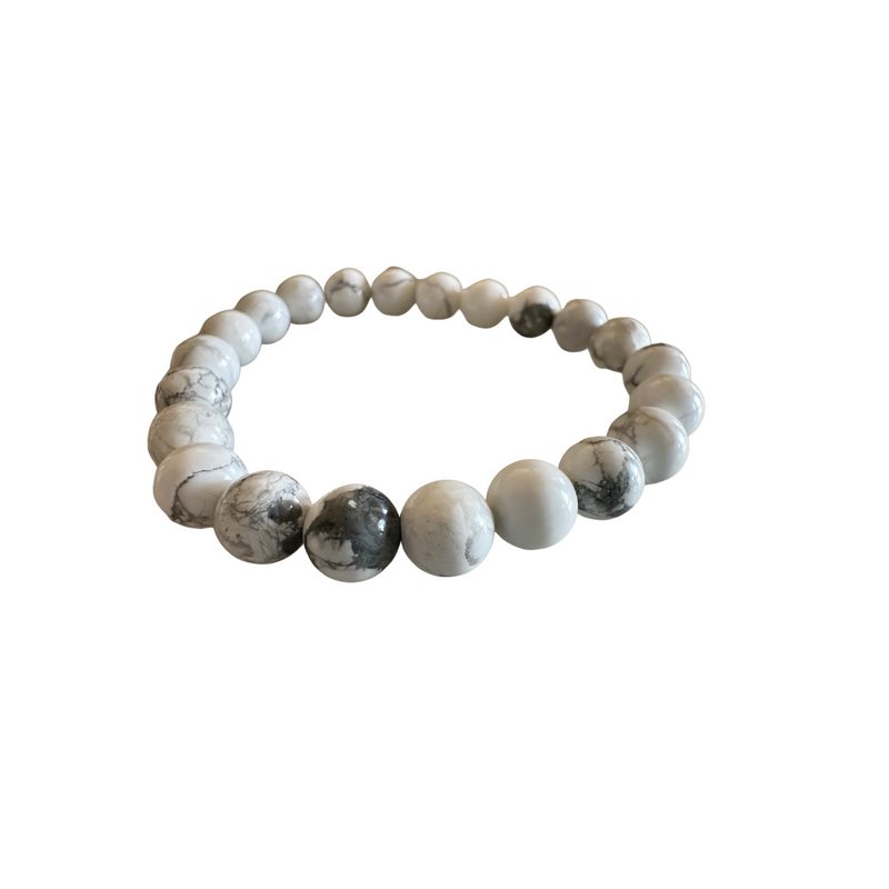 Howlite gemstone beaded stretch bracelet with white and gray marbled beads on white background — Crabby Mermaid